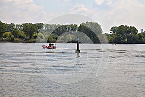 Italian firefighters boats on a lake during a training