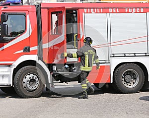 Italian firefighters during an emergency with protective suits a