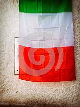 Italian flag against a wall