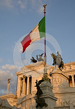 Italian flag with Altare del Patria on the background