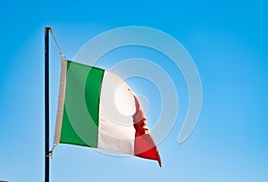 Italian flag on a blue sky, problems, ilaty recession concept, Bandiera d\'Italia, flutter flag Italy photo