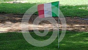 Italian flag in green background wind golf course