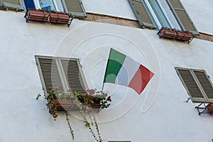 Italian flag placed on a balcony