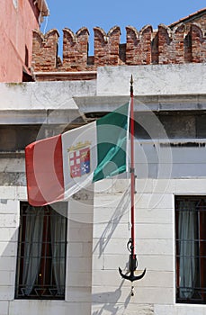 Italian flag with the symbols of the Italian maritime republics