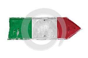 Italian flag traditional colors green, white and red painted over arrow shape from a rusty and grunge metal iron plate