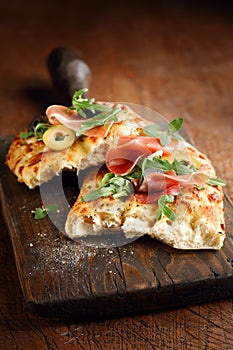 Italian focaccia bread with ham and olives