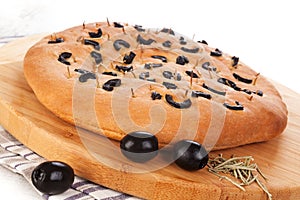 Italian foccacia bread with black olives. photo