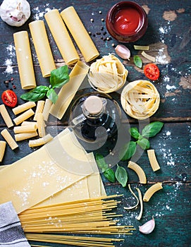 Italian food background with different types of pasta, health or vegetarian concept.