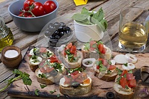 Italian food, bruschettes,tomatoes,basil, cutting board, Delicious snack, appetizer to wine, snack, crostini, fresh, healthy,