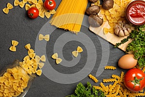 Italian food concept. Pasta ingredients. Cherry-tomatoes, spaghetti pasta, rosemary and spices