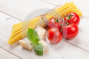 Italian food cooking ingredients. Pasta, tomatoes, basil