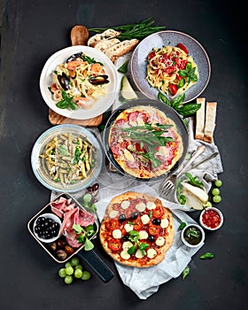 Italian food  on dark background