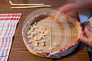 Italian food. Elderly housewife prepares the Cicciones, the traditional gnocchi of handmade pasta, typical of northern Sardinia