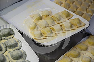 Italian food, fresh home made stuffed pasta tortelli or ravioli dumplings ready to cook, Parma, Emilia Romagna, Italy