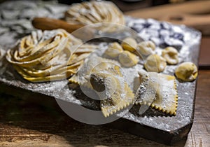 Italian food, fresh home made stuffed pasta tortelli or ravioli dumplings ready to cook, Parma, Emilia Romagna, Italy