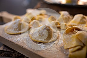 Italian food, fresh home made stuffed pasta tortelli or ravioli dumplings ready to cook, Parma, Emilia Romagna, Italy