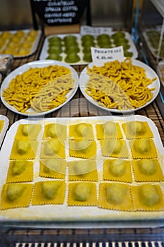 Italian food, fresh home made stuffed pasta tortelli or ravioli dumplings ready to cook, Parma, Emilia Romagna, Italy. Italian