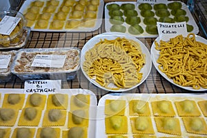 Italian food, fresh home made stuffed pasta tortelli or ravioli dumplings ready to cook, Parma, Emilia Romagna, Italy. Italian