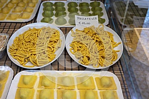 Italian food, fresh home made stuffed pasta tortelli or ravioli dumplings ready to cook, Parma, Emilia Romagna, Italy. Italian