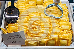 Italian food, fresh homemade pasta pumpkin and amaretti ravioli ready to cook on Portobello road food market, London