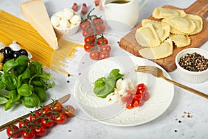 Italian food or ingredients background with fresh vegetables, pasta, cheese parmesan