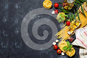 Italian food and ingredients background with fresh vegetables, tomatos, olive oil, oregano, garlic, salt, pepper, basil