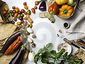 Italian food ingredients background with vegetables, salt, spices and herbs, cheese, olive oil, basil, bell peppers, eggplant and