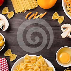 Italian food ingredients frame with various pasta, vegetables, mushrooms, olives. Flat lay on dark wooden background