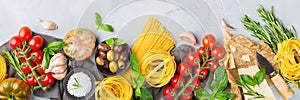 Italian food ingredients with pasta, tomatoes, cheese, olive oil, basil