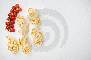 Italian food ingredients pasta, on white stone table background, top view flat lay, with copy space for text