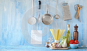 Italian food, ingredients for spaghetti dish and kitchen utensils, panorama good copy space