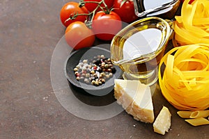 Italian food ingredients - vegetables, olive oil, spices and parmesan