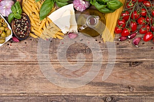 Italian food ingredients on wooden background