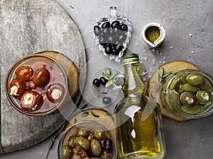 Italian food with Olives, Olive Oil, Cheese on concrete background copy space