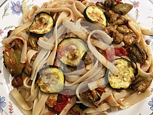 Italian Food Pasta With Eggplant, Zucchin and Sun Dried Tomatoes