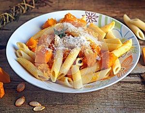 Italian food - Penne pasta with pumpkin photo