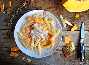 Italian food - Penne pasta with pumpkin photo