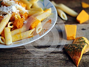 Italian food - Penne pasta with pumpkin photo