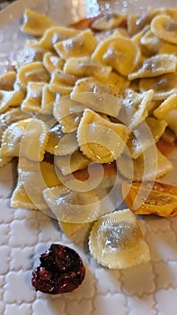 italian food: ravioli with pomodorini confit photo