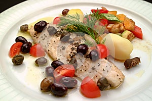 Italian food recipes, Ligurian branzino sea bass slice with olives, capers, tomatoes