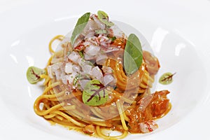 Italian food speciality, spaghetti seafood sauce with red prawns( gambero rosso) tartare photo