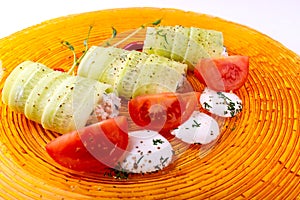 Italian food on white background. Mozzarella cheese, fresh basil leaves, tomatoes, olive oil, cheese rolls and greens on