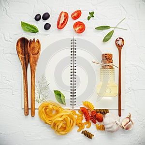 Italian foods concept and menu design . Various pasta elbow macaroni ,fusilli ,fettucini with ingredients sweet basil, sage