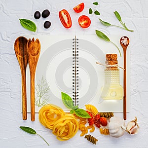 Italian foods concept and menu design . Various pasta elbow macaroni ,fusilli ,fettucini with ingredients sweet basil, sage