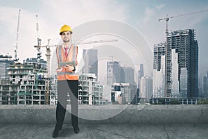 Italian foreman uses tablet on the rooftop photo