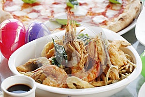 italian fried seafood fritto misto, italian food speciality food with easter egg