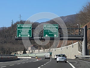 Italian highway junction with text of street names and cities photo