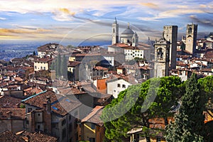 Bergamo, old town, view with towers over sunset. Lombardia, Italy photo