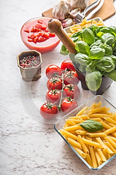 Italian ingredients pasta tomatoes basil spices and garlic