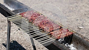 italian kebabs skewers called Arrosticini abruzzese from the Italy region Abruzzo made by lamb meat on grill